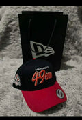 New Era San Francisco 49ers hat features a red brim, black crown, and a "60 Seasons" side patch.