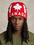 red Bioworld knit beanie features a white maple leaf and bold lettering