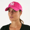 New Era 9FORTY League Essential New York Yankees Cap in a vibrant pink color featuring an embroidered white Yankees logo on the front.