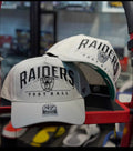 47 Brand Las Vegas Raiders cap featuring a prominent embroidered script logo and a green undervisor.