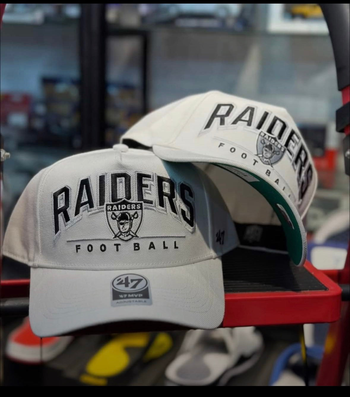 47 Brand Las Vegas Raiders cap featuring a prominent embroidered script logo and a green undervisor.