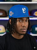 New Era 59FIFTY fitted hat, specifically a blue Charros de Jalisco baseball cap adorned with a 2003 All-Star Game side patch.