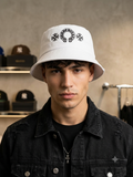 white Chrome Hearts bucket hat features a prominent black embroidered horseshoe logo on the front.