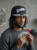 New Era 59Fifty fitted cap for the San Diego Padres, featuring a black crown, a gray visor, and a script logo on the front.