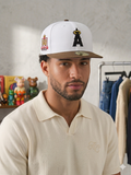 New Era 59FIFTY Los Angeles Angels fitted hat features a white crown, brown brim, and a special Angel Stadium 50th Anniversary side patch.