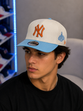 New Era New York Yankees "Color Pack" 9FIFTY snapback hat featuring a light blue visor and rust-orange logo.