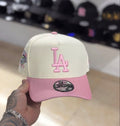 New Era Los Angeles Dodgers 9FORTY A-Frame hat features a cream crown, a pink visor, and pink embroidered "LA" logo
