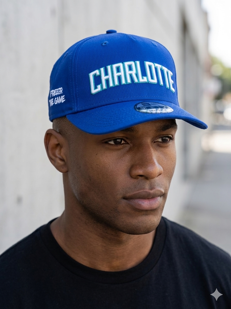 Mitchell & Ness Charlotte Hornets blue snapback hat featuring a prominently embroidered "CHARLOTTE"