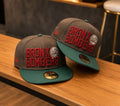 New Era New York Yankees "Bronx Bombers" cap featuring a brown crown and green visor.