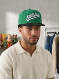 New Era 59FIFTY Oakland Athletics fitted cap features a vibrant green crown with a contrasting black brim.
