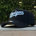 New Era Dodgers 9FORTY A-Frame features a black crown with a contrasting white script logo.