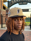 Florida Marlins 59FIFTY fitted hat by New Era features a khaki crown and black visor with a side patch marking the team's 25th anniversary