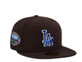 Brown New Era Los Angeles Dodgers 50th Anniversary Throwback Edition 59FIFTY fitted cap features a blue embroidered LA logo and a commemorative stadium patch.