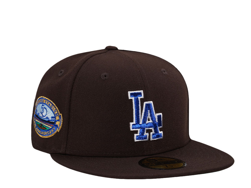 Brown New Era Los Angeles Dodgers 50th Anniversary Throwback Edition 59FIFTY fitted cap features a blue embroidered LA logo and a commemorative stadium patch.