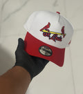 New Era 9FORTY baseball cap features a white crown with a red visor and embroidered team logo.
