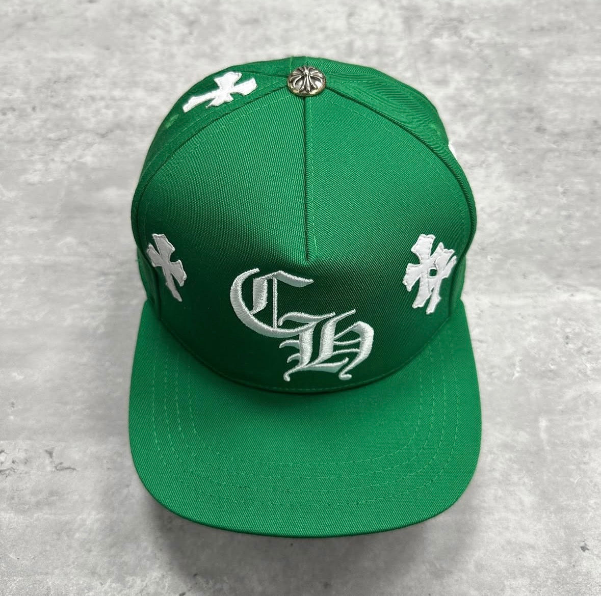 image is a Chrome Hearts CH Hat in green