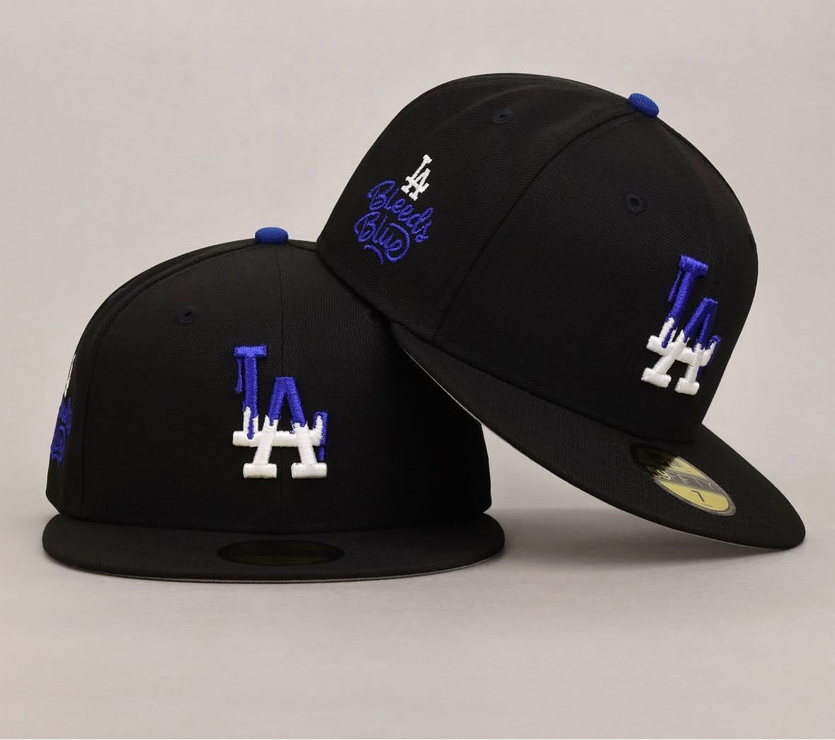 New Era Los Angeles Dodgers "LA Bleeds Blue" 59FIFTY fitted cap features a distinctive blue drip effect on the white logo