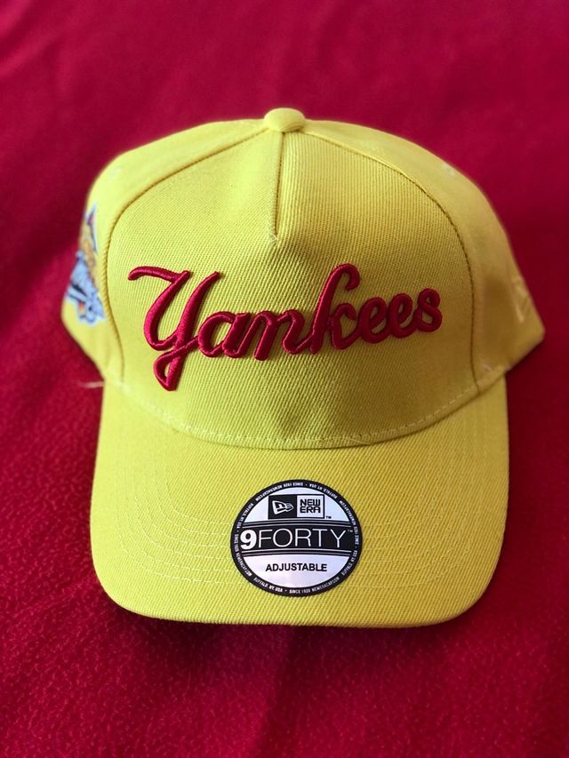 Bright yellow New Era New York Yankees 9FORTY A-Frame snapback cap featuring a "Yankees" script logo on the front and a 1999 World Series side patch.