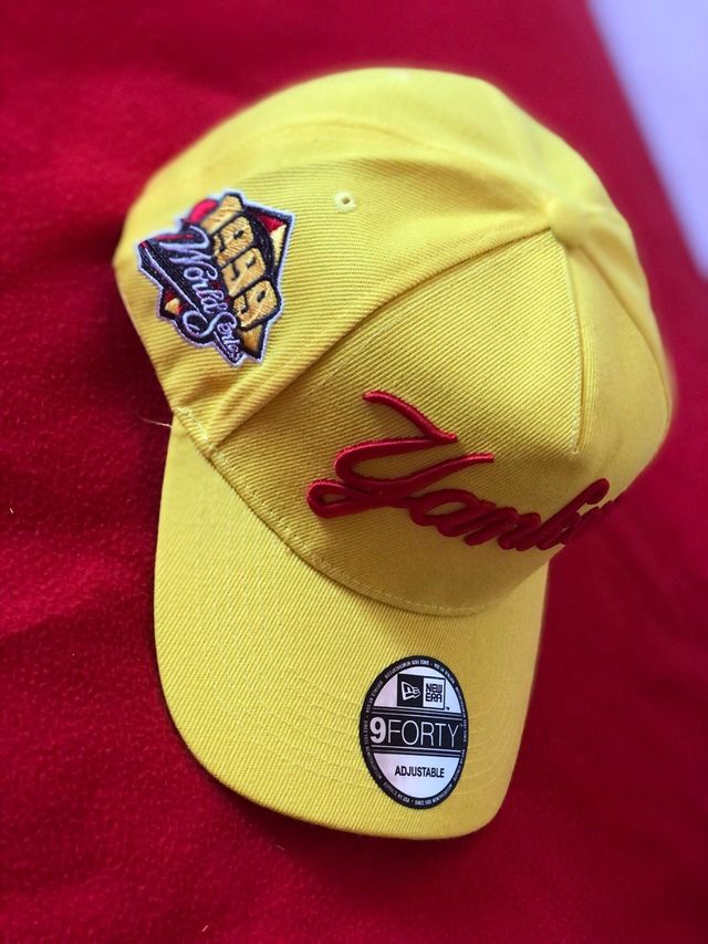 Bright yellow New Era New York Yankees 9FORTY A-Frame snapback cap featuring a "Yankees" script logo on the front and a 1999 World Series side patch.