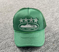 Green  Corteiz (CRTZ) trucker hat featuring white embroidered stars and an island logo on the front