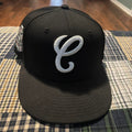 black Chicago White Sox fitted cap is a collaboration piece featuring a prominent white embroidered script "C" on the front panel