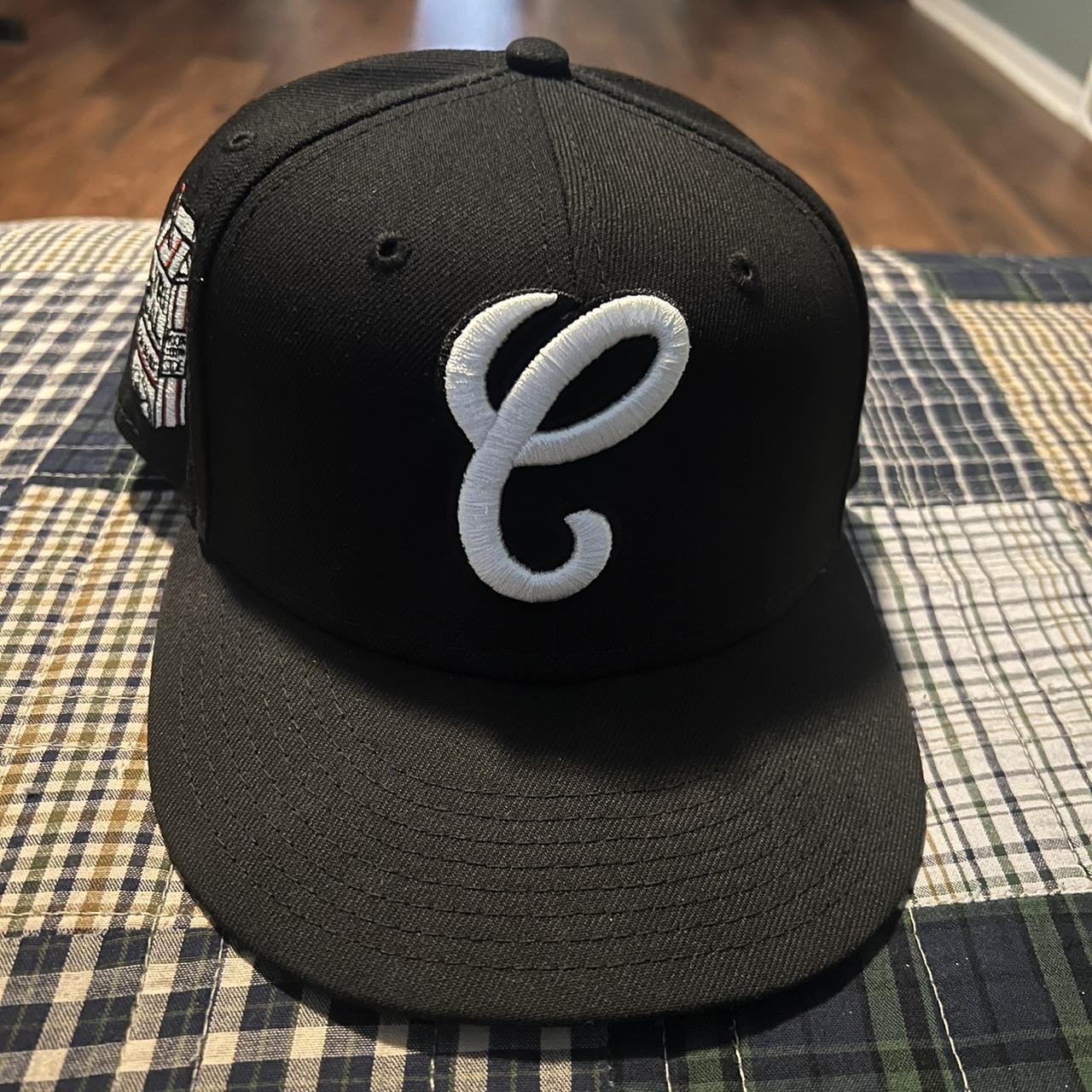 black Chicago White Sox fitted cap is a collaboration piece featuring a prominent white embroidered script "C" on the front panel