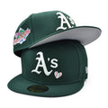 green New Era Oakland Athletics 59FIFTY fitted cap features a unique "Team Heart" embroidered logo design on the front panel.