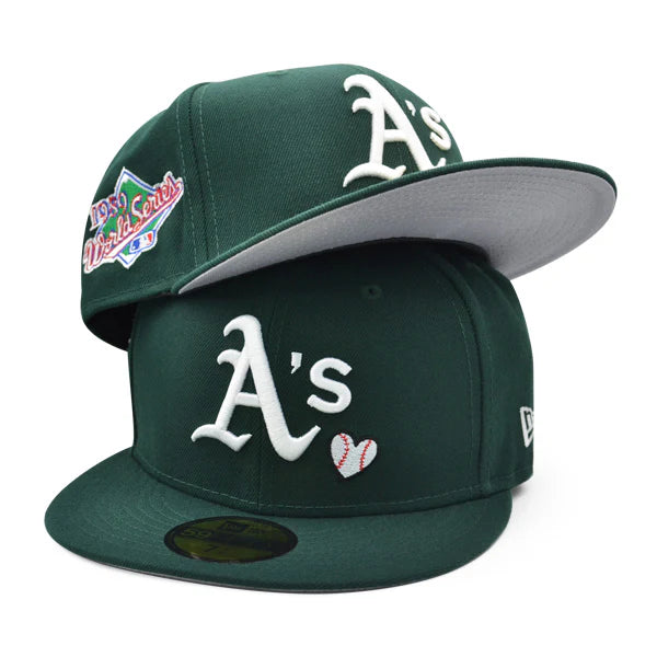 green New Era Oakland Athletics 59FIFTY fitted cap features a unique "Team Heart" embroidered logo design on the front panel.