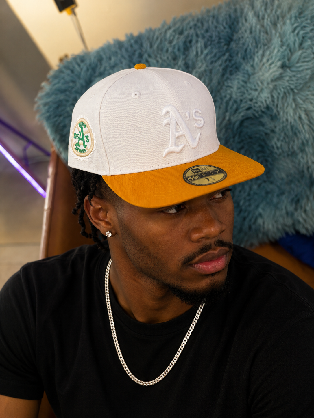 New Era Oakland Athletics 59Fifty fitted cap featuring a white crown and a gold visor.